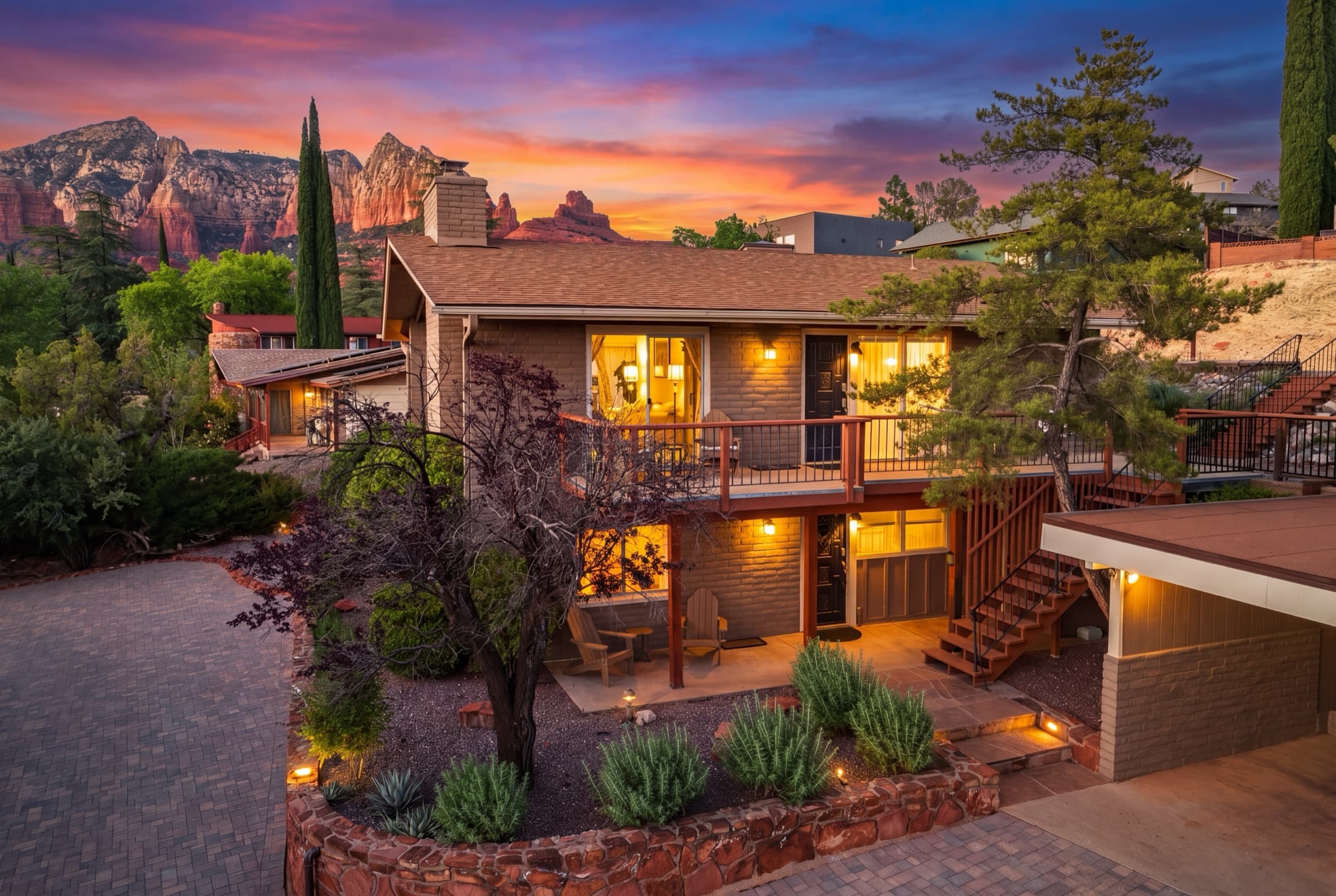 The home at sunset with the red rocks of Sedona in the background