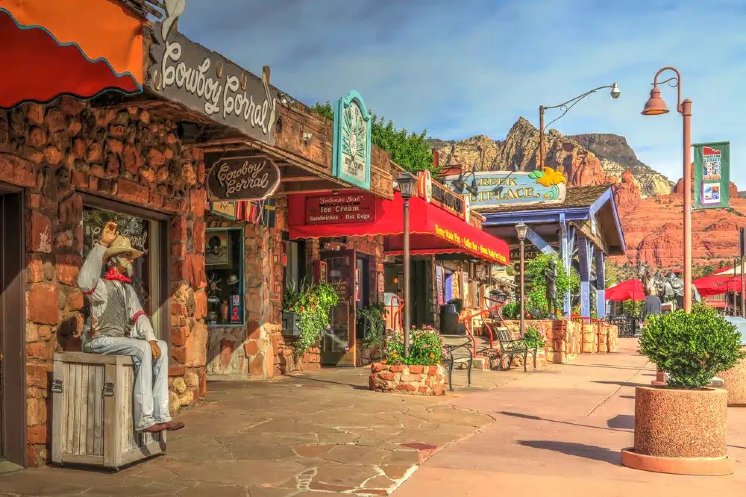 Uptown Sedona main strip — Cowboy Corral, galleries, red rocks in the distance